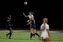 Desert Oasis senior Kate Perkes (2) goes up for a header against Centennial High School during ...