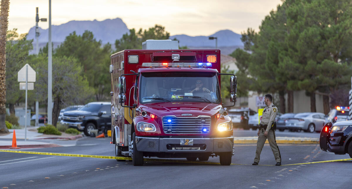 A Las Vegas Fire ambulance leaves the entrance area of Tuscany Trails down the street from the ...
