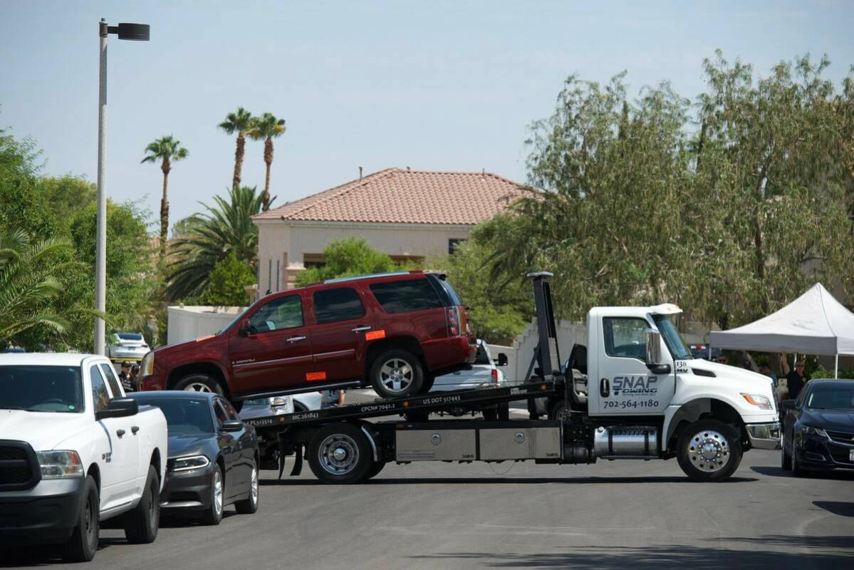 A vehicle is towed from the home of Clark County Public Administrator Robert Telles on Wednesda ...