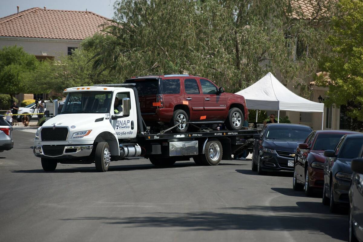 A vehicle is towed from the home of Clark County Public Administrator Robert Telles on Wednesda ...