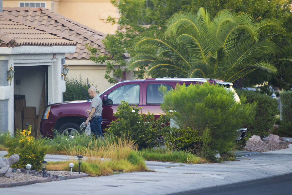 Clark County Public Administrator Robert Telles washes his car outside his home on Tuesday, Sep ...
