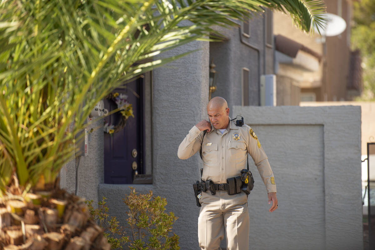 A police officer arrives at the home of Clark County Public Administrator Robert Telles hours a ...