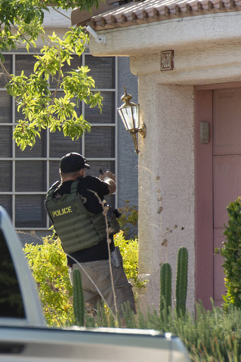 Police activity outside the home of Clark County Public Administrator Robert Telles as police m ...
