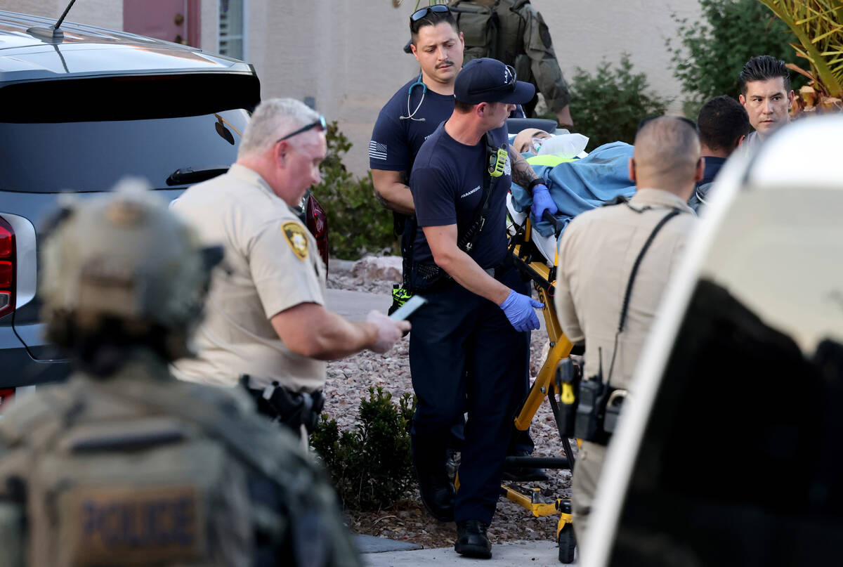 Las Vegas police and emergency personnel escort Clark County Public Administrator Robert Telles ...