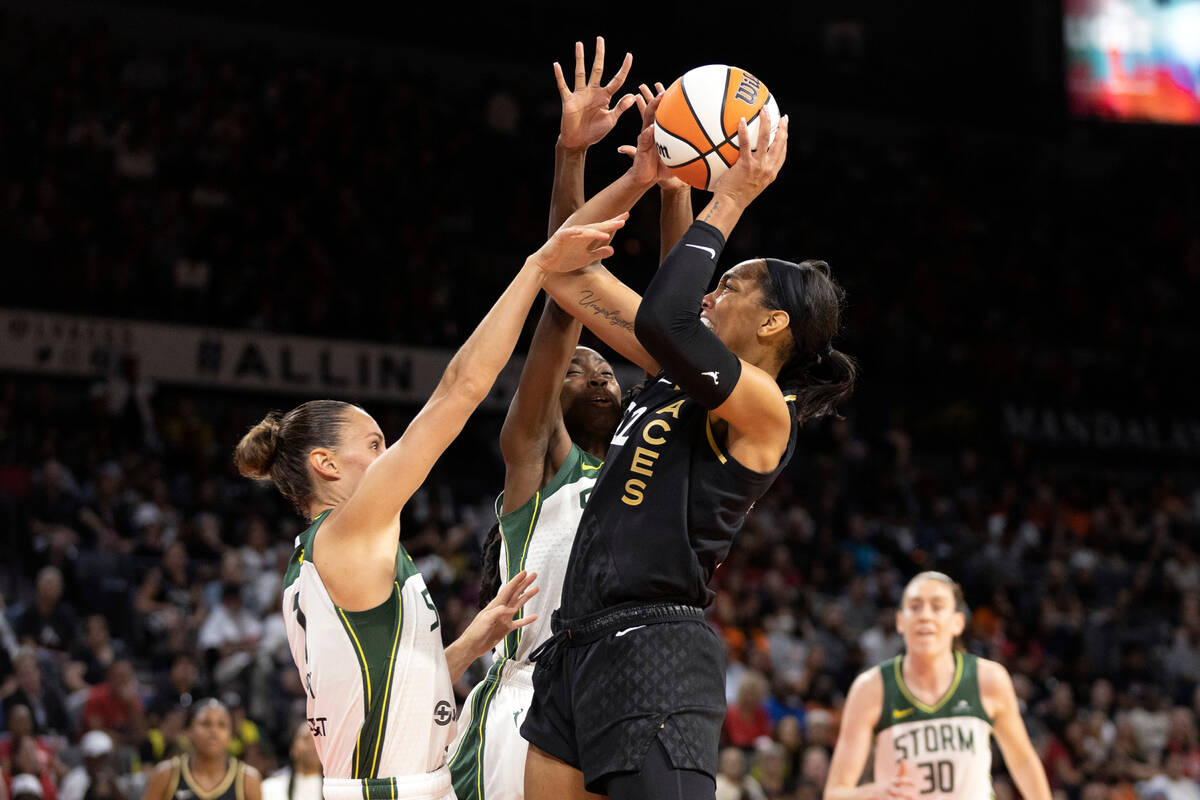 Seattle Storm forward Stephanie Talbot, left, and Seattle Storm center Ezi Magbegor, center, at ...