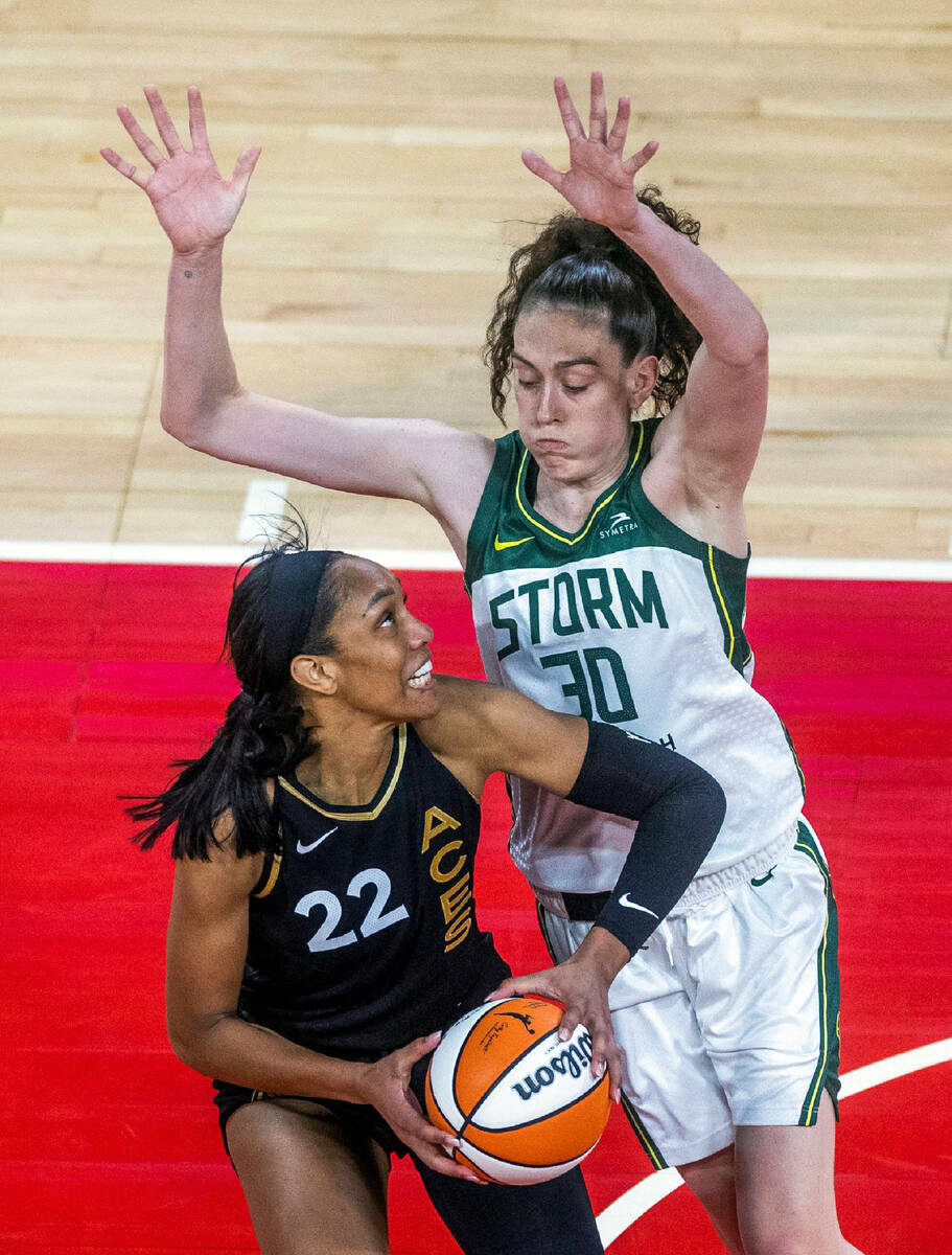 Las Vegas Aces forward A'ja Wilson (22) is smothered by Seattle Storm forward Breanna Stewart ( ...