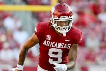 Arkansas wide receiver Jadon Haselwood (9) runs a play against Cincinnati during an NCAA footba ...