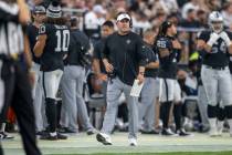 Raiders head coach Josh McDaniels walks the sideline during the second half of an NFL game agai ...