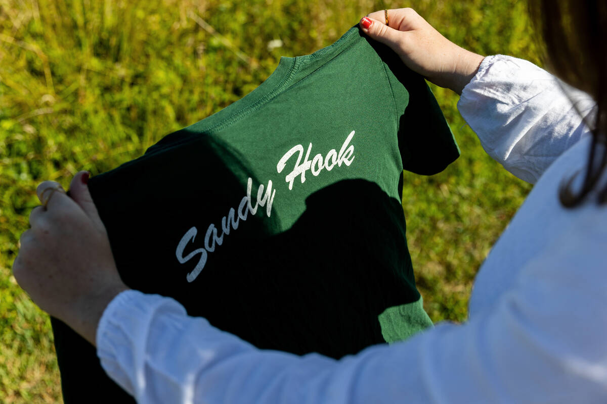 Jackie Hegarty, a rising senior at Newtown High School, holds a Sandy Hook Elementary School t- ...