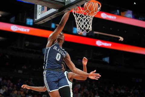 Sierra Canyon guard Bronny James dunks during a basketball game against Perry, on Saturday, Dec ...