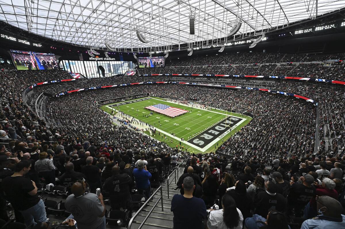 Fans fill Allegiant Stadium before an NFL football game between the Las Vegas Raiders and the W ...