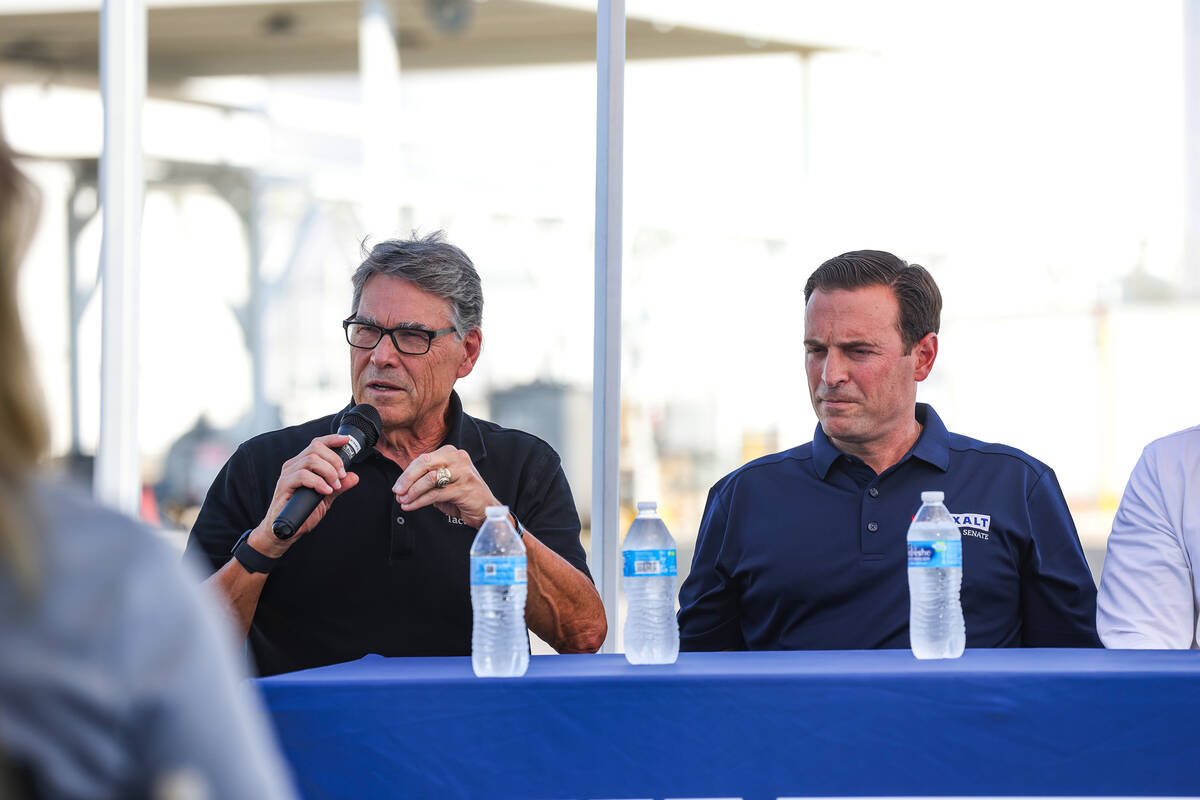 Former Texas Gov. Rick Perry speaks next to U.S. Senate candidate Adam Laxalt at a panel discus ...