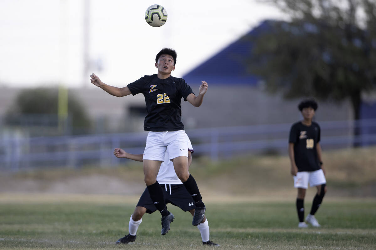 Durango’s Joshua Wong (22) heads the ball during a high school soccer game against Cimar ...
