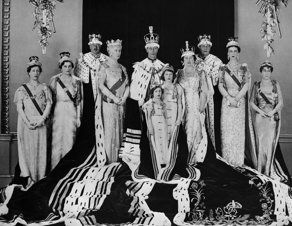 Britain's King George VI, centre, poses with his wife Queen Elizabeth, centre right, daughters ...