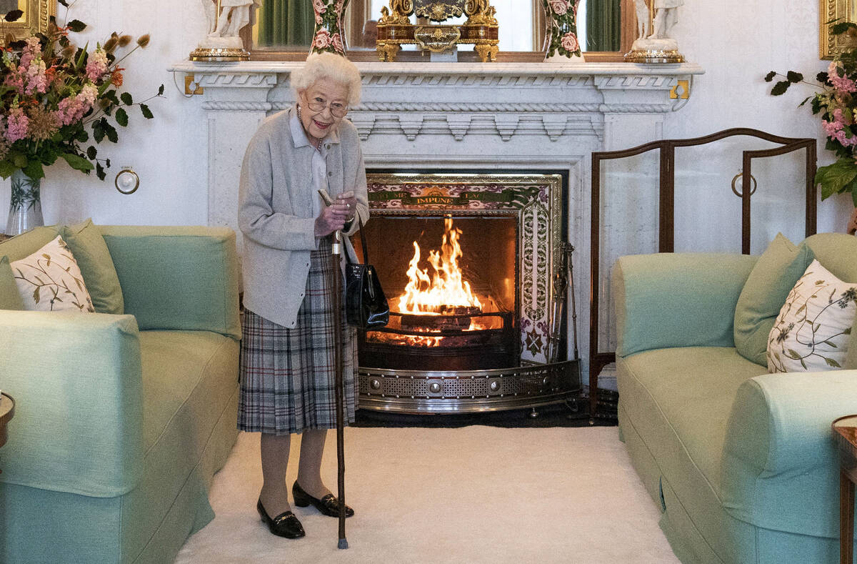 FILE - Britain's Queen Elizabeth II waits in the Drawing Room before receiving Liz Truss for an ...