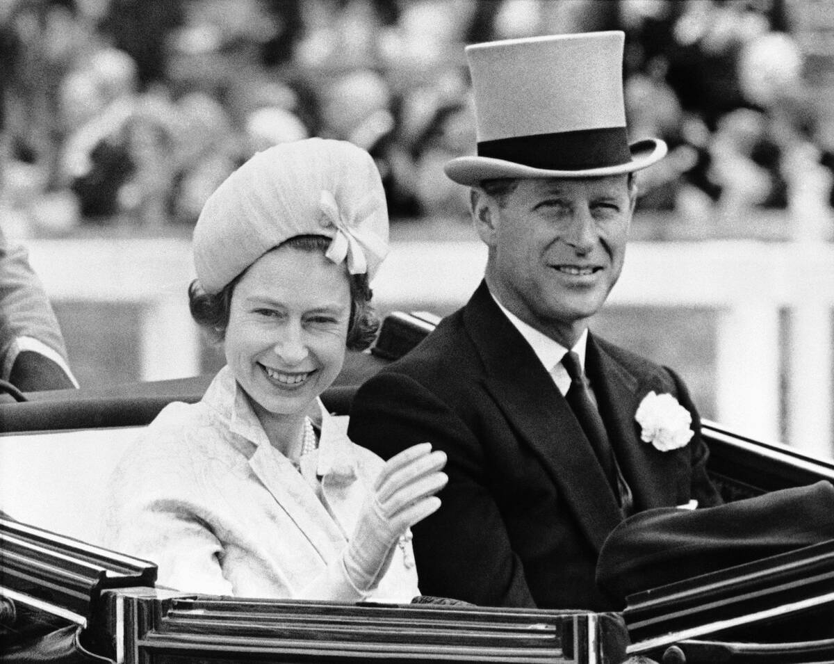 Prince Philip wore traditional gray topper as he escorted Queen Elizabeth II to the races at As ...