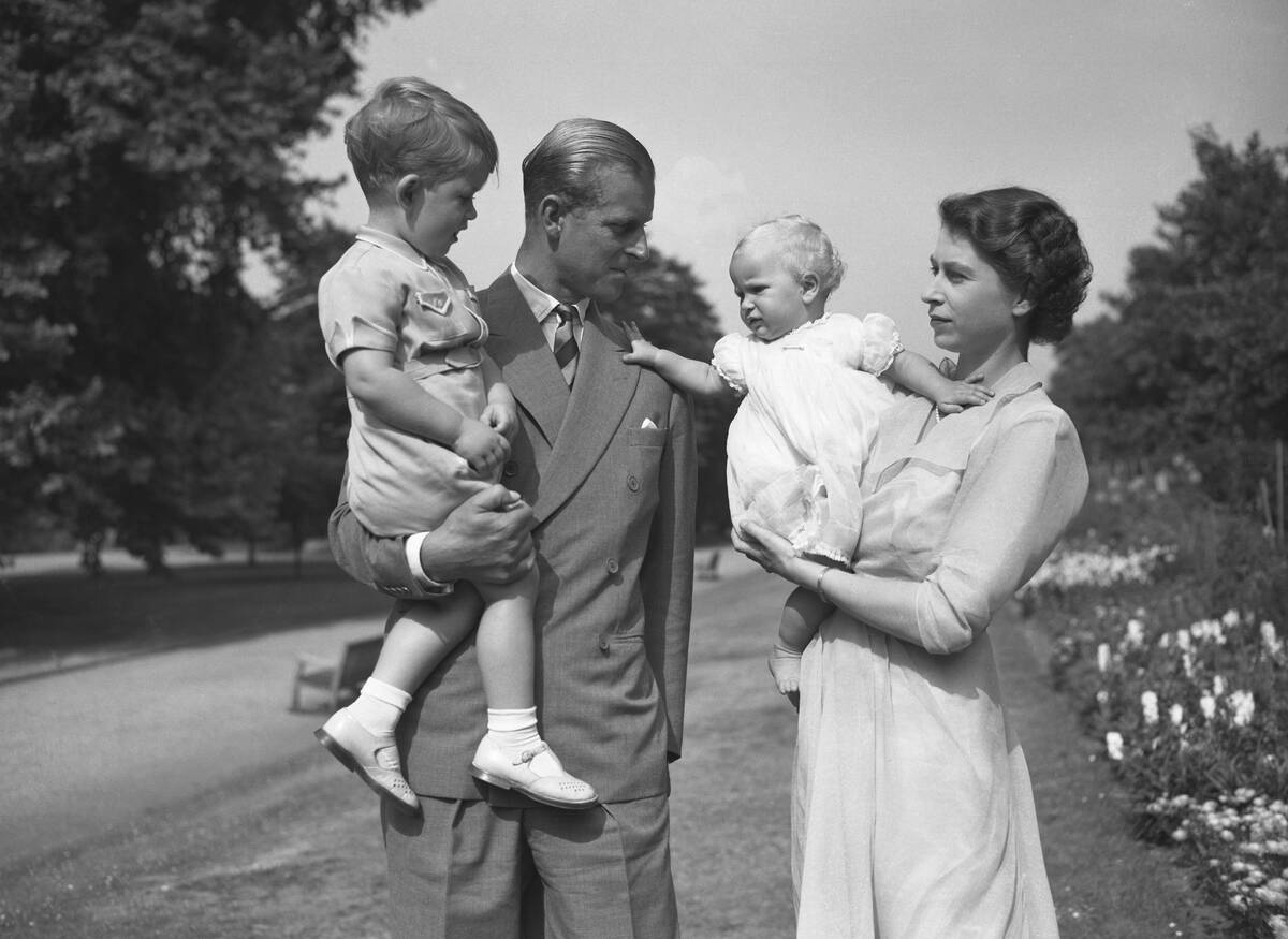 Princess Elizabeth stands with her husband Prince Philip, the Duke of Edinburgh, and their chil ...