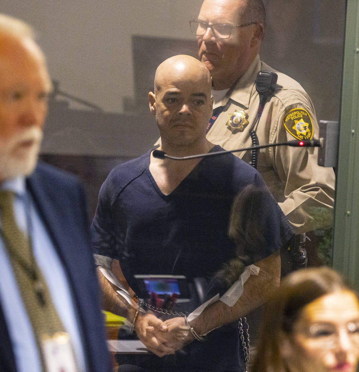 Clark County Public Administrator Robert Telles is led into the courtroom during his initial co ...