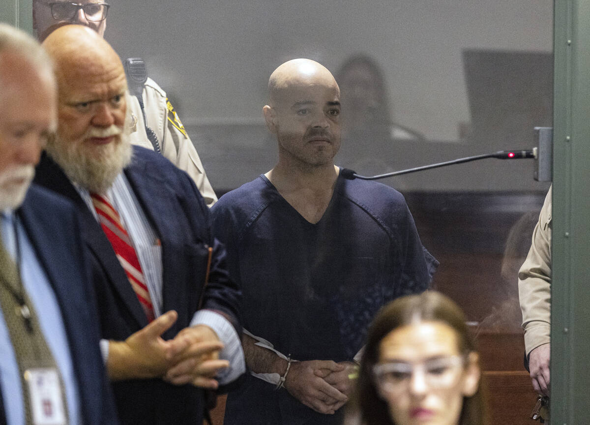 Clark County Public Administrator Robert Telles appears in court with his attorney Travis Shetl ...