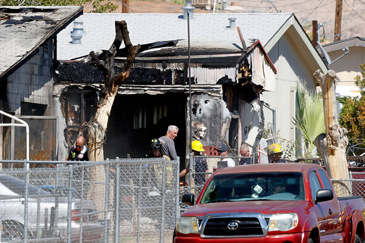 Officials investigate a fatal fire on Yellowstone Avenue, Monday, Sept. 5, 2022, in northeast L ...
