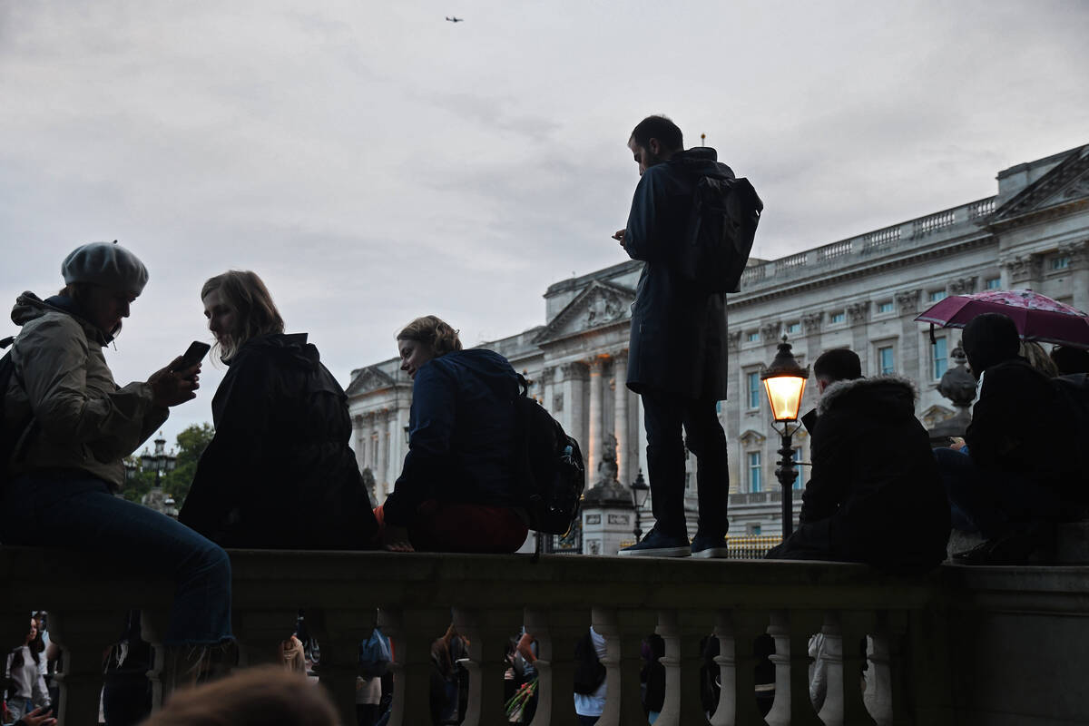 Mourners are seen in silhouette on Thursday, Sept. 8, 2022.(Nick Robertson)