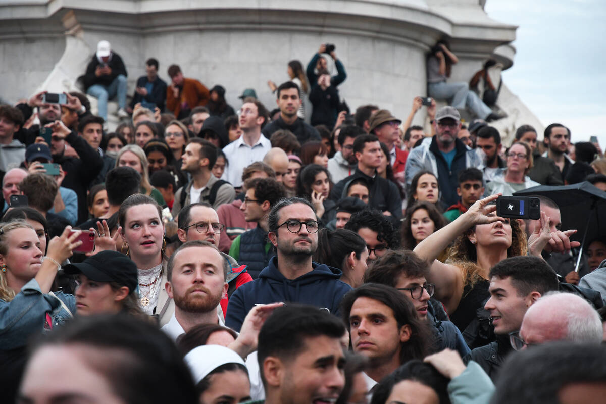 A crowd of people gathered at Buckingham Palace on Thursday, Sept. 8, 2022, to remember Queen E ...
