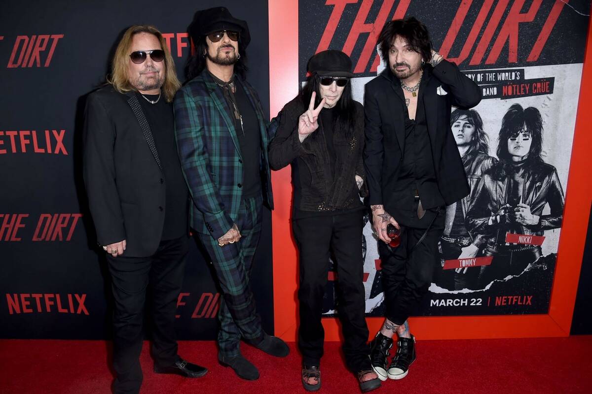 Vince Neil, from left, Nikki Sixx, Mick Mars and Tommy Lee, of Motley Crue, arrive at the world ...