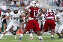 Liberty’s Tyrese Smith (11) passes the ball while Palo Verde’s Sam Builes (33) ci ...