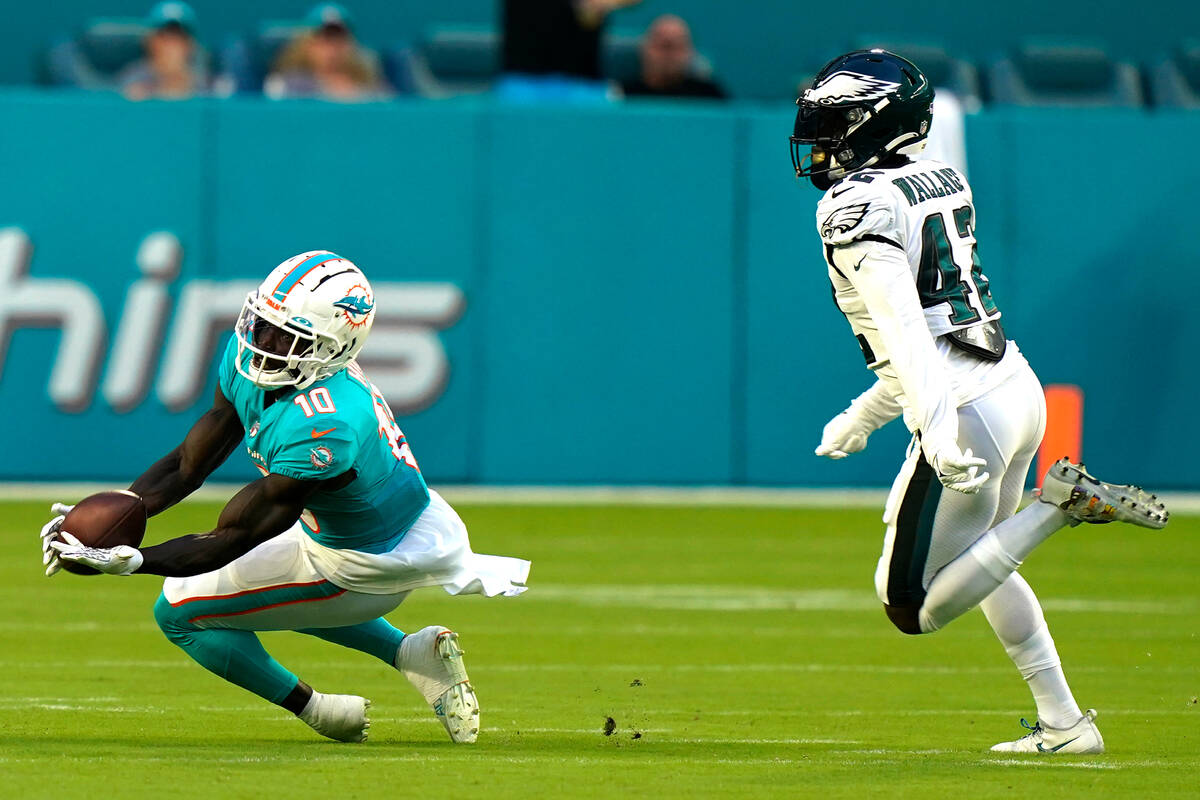 Miami Dolphins wide receiver Tyreek Hill (10) grabs a pass as Philadelphia Eagles safety K'Von ...