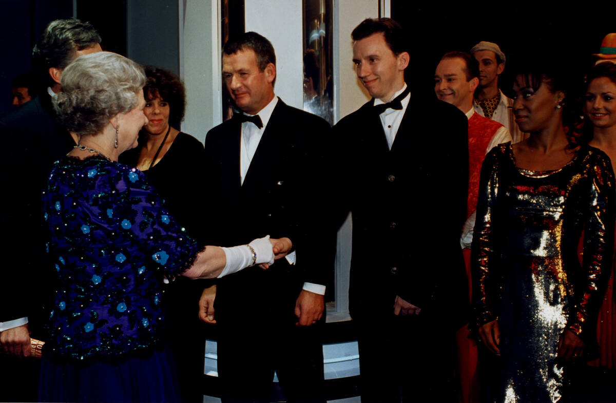 FILE - Andy Walmsley is shown meeting Queen Elizabeth II after the 1995 "Royal Variety Show" in ...