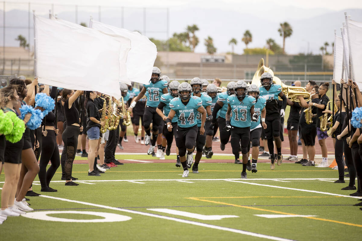 Silverado High School football team runs out onto the field as they host Sierra Vista on Friday ...