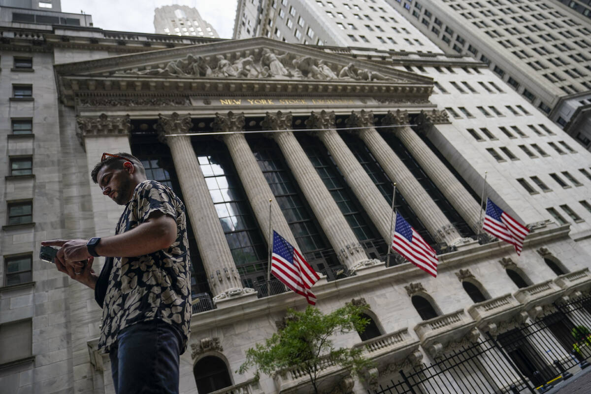 FILE - Pedestrians walk past the New York Stock Exchange, on July 8, 2022, in New York. Stocks ...