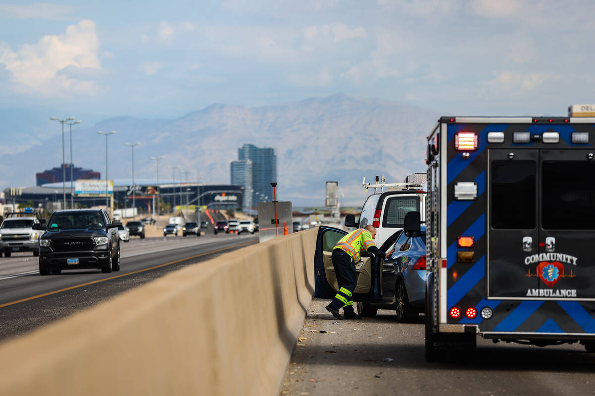 Stephen San Filippo, a supervisor Freeway Service Patrol operator, checks on passengers who wer ...