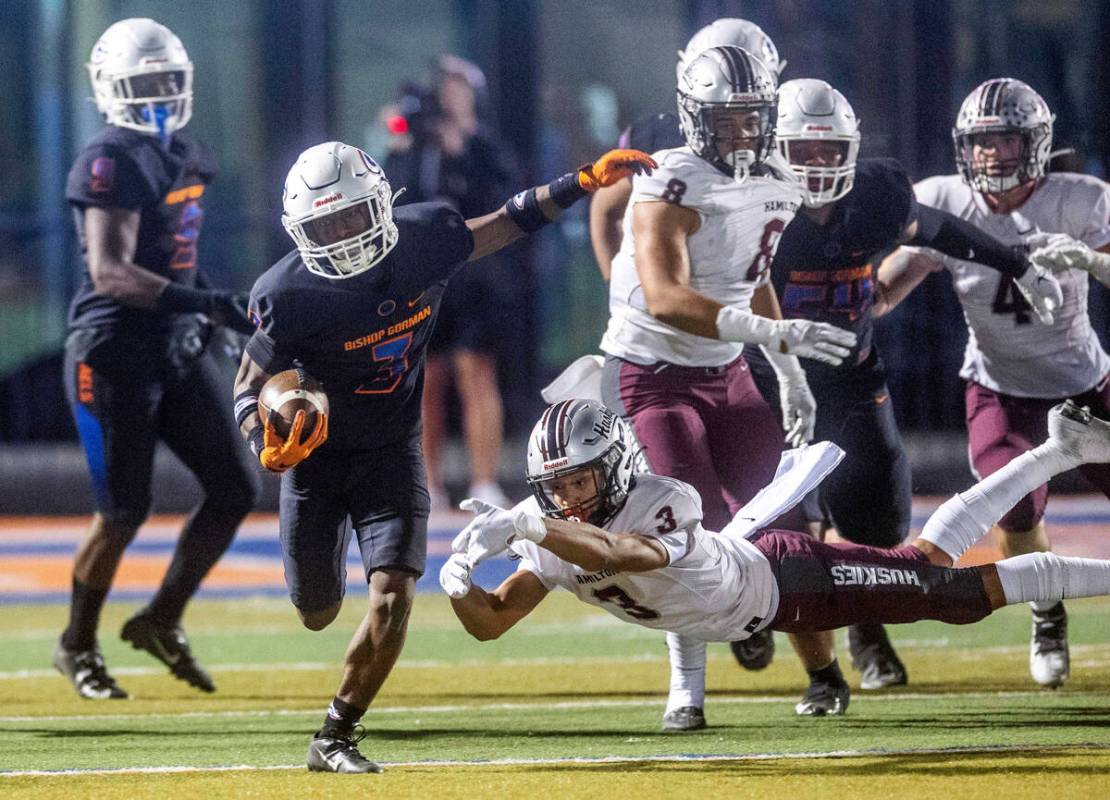 Bishop Gorman running back Devon Rice (3) breaks into open field after missed tackle by Hamilto ...