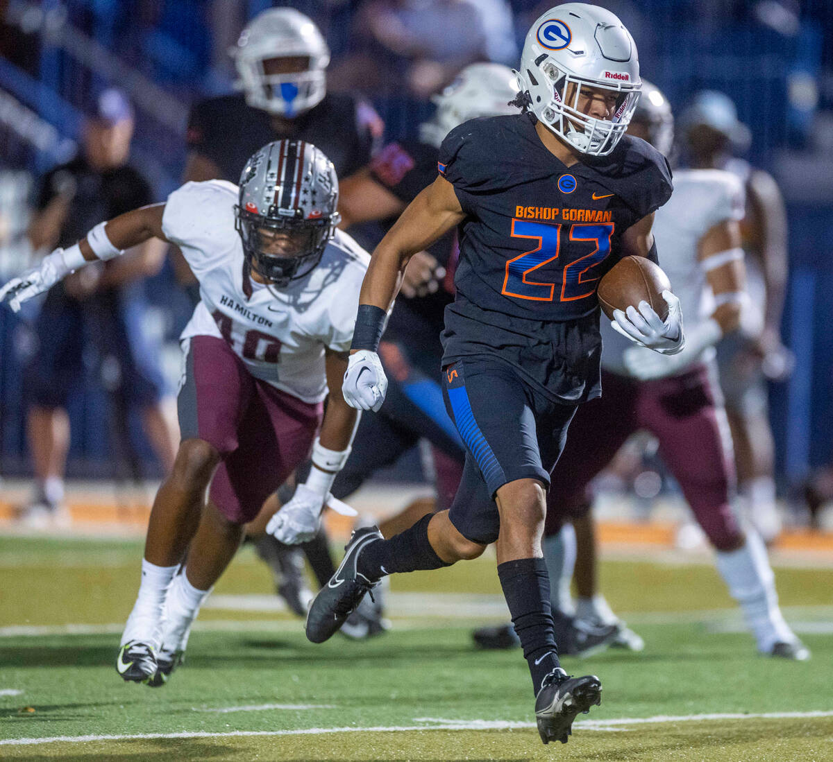 Bishop Gorman running back Micah Kaapana (22) sprints into the end zone for a score past Hamilt ...