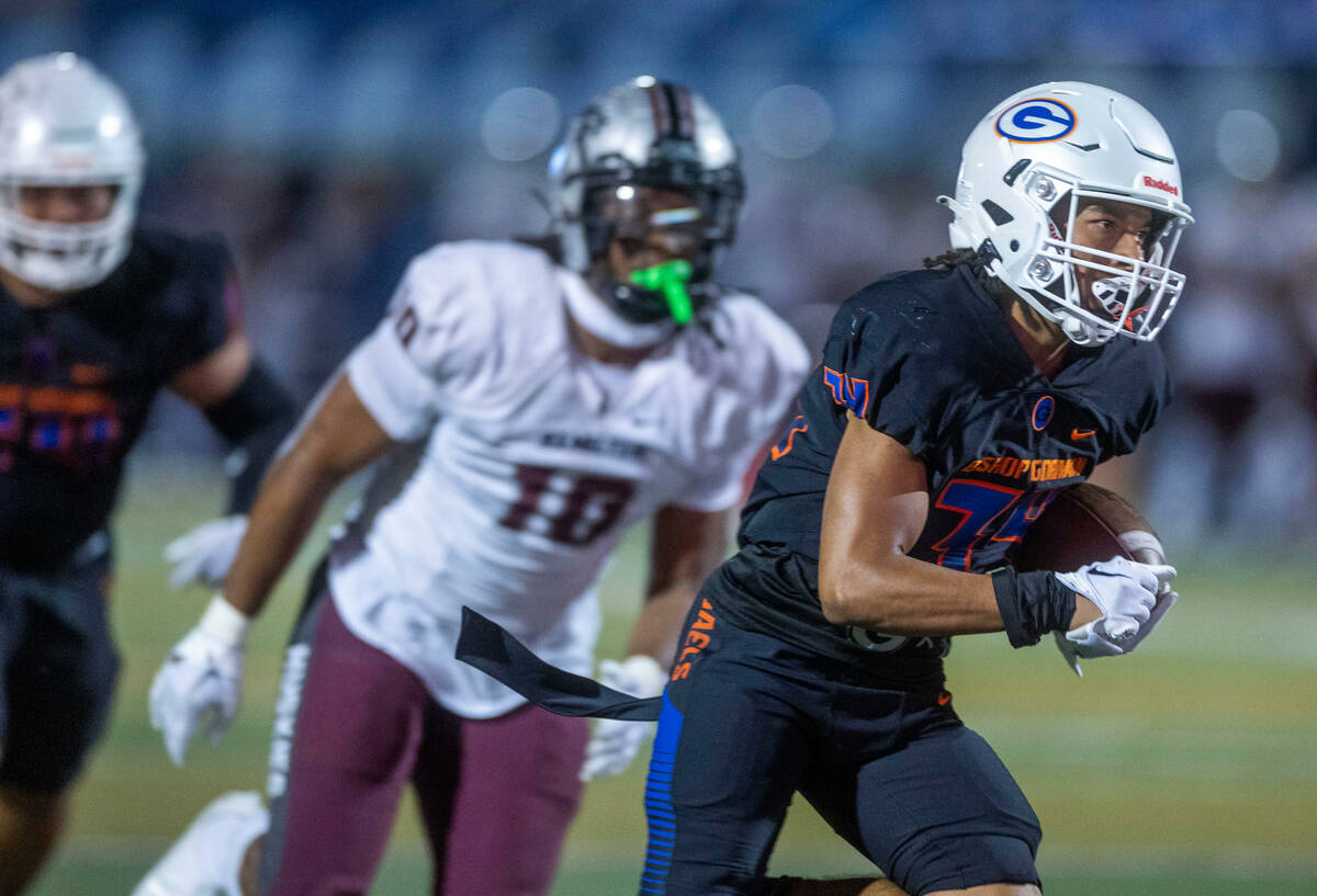 Bishop Gorman running back Myles Norman (34) heads towards the end zone over a Hamilton defende ...