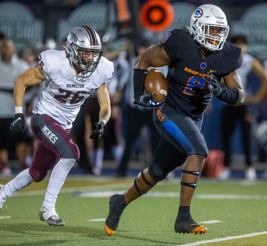Bishop Gorman defensive lineman Jayden House (8) runs back an interception as Hamilton running ...