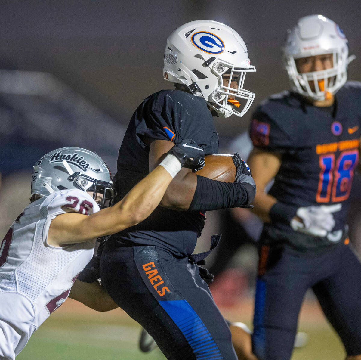 Bishop Gorman defensive lineman Jayden House (8) runs back an interception as Hamilton running ...