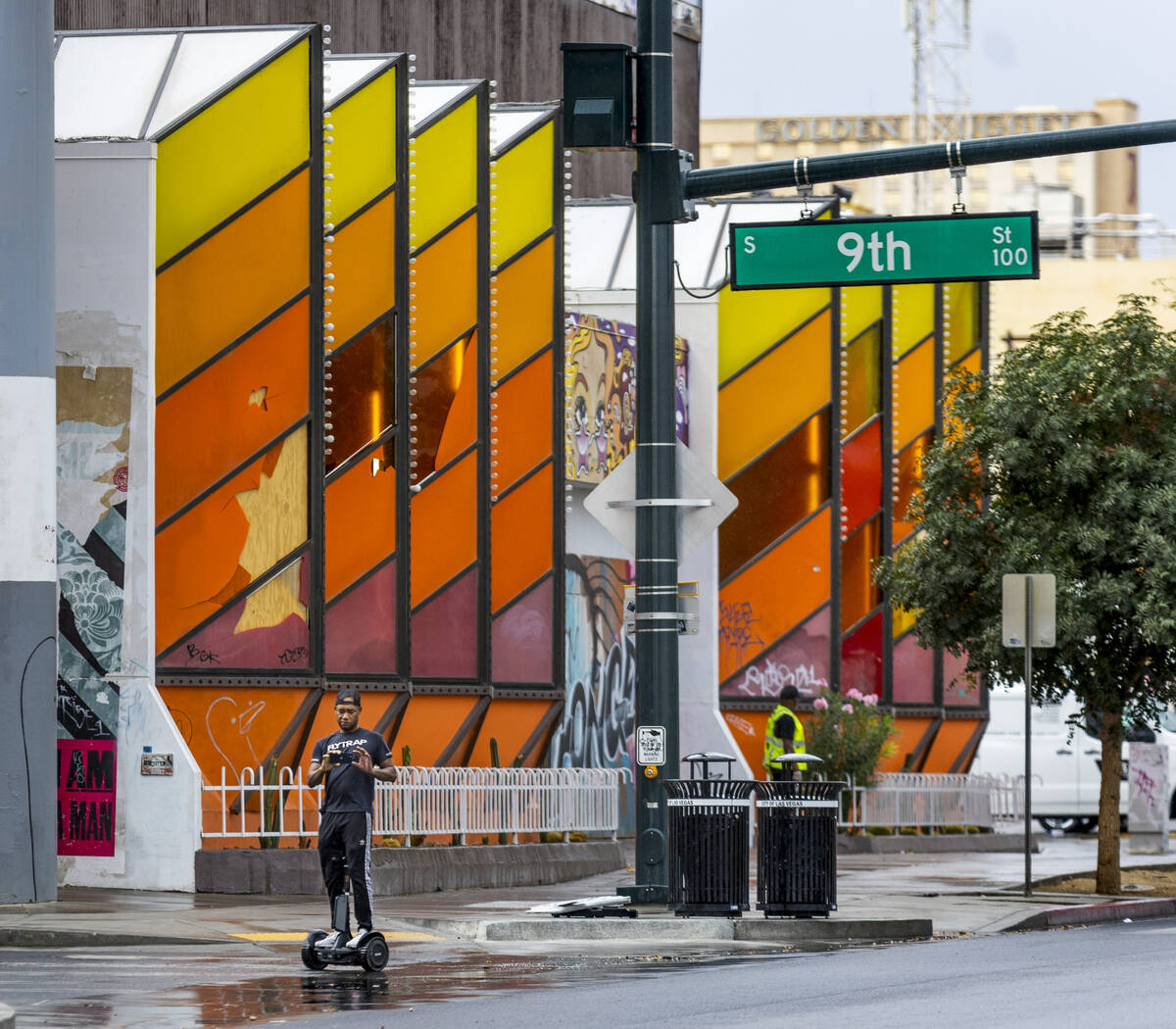 A man cruises along East Fremont Street on a rainy day in Downtown on Saturday, Sept. 10, 2022, ...