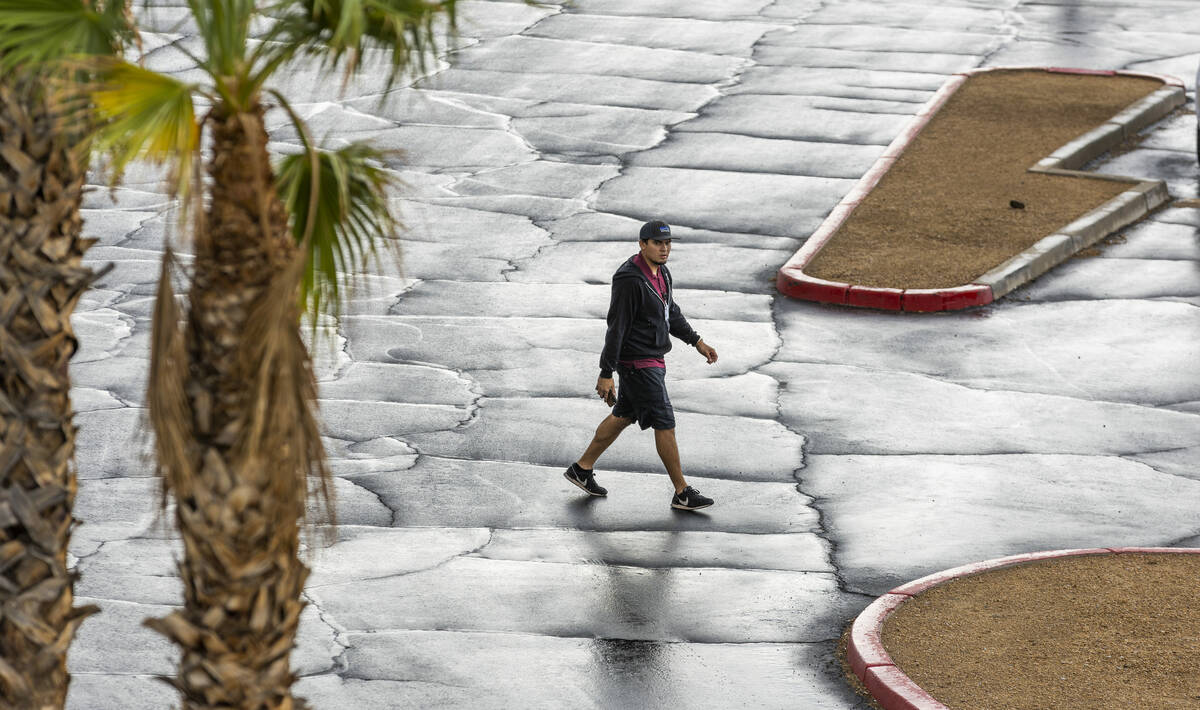 The pavement glistens after a rain in the parking lot at Desert Breeze Community Center on Satu ...