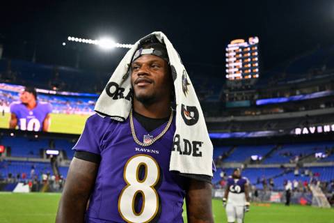 Baltimore Ravens quarterback Lamar Jackson (8) looks on after a NFL preseason football game aga ...