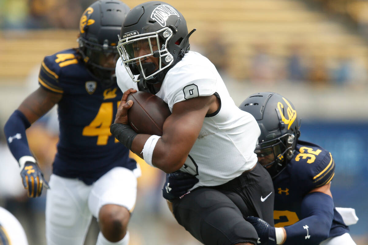 UNLV Rebels running back Aidan Robbins (9) is tackled by California Golden Bears safety Daniel ...
