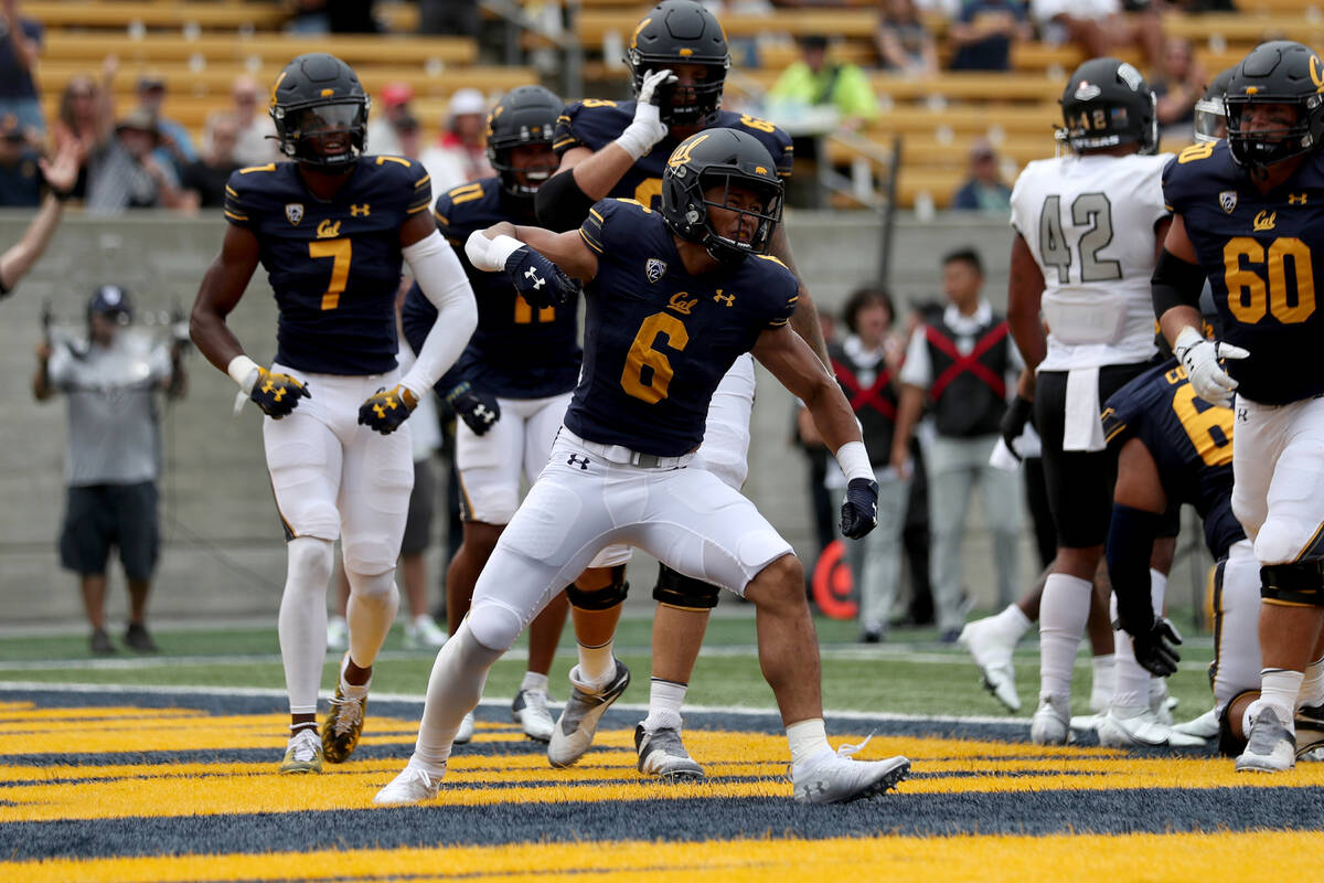 California running back Jaydn Ott (6) celebrates after running for a touchdown against UNLV dur ...