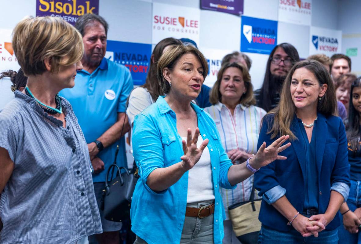 Senator Amy Klobuchar, center, speaks beside Representative Susie Lee, left, and Tiffany Muller ...