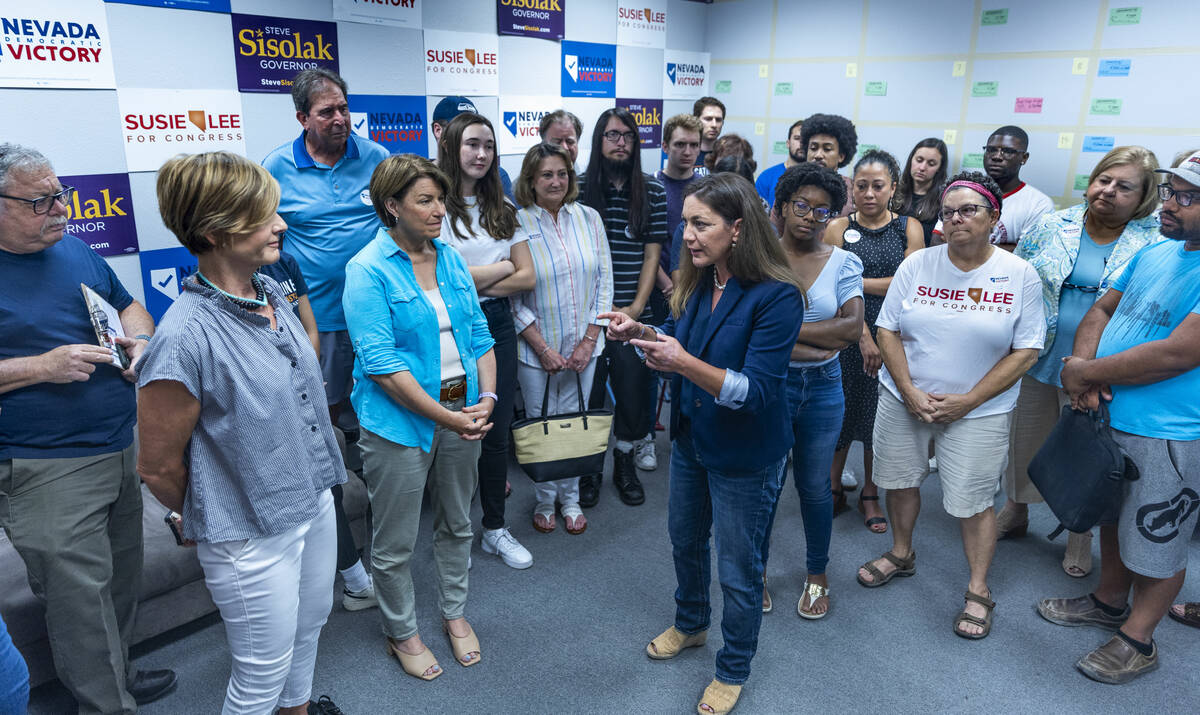 President Tiffany Muller with End Citizens United, center, addresses Senator Amy Klobuchar, cen ...