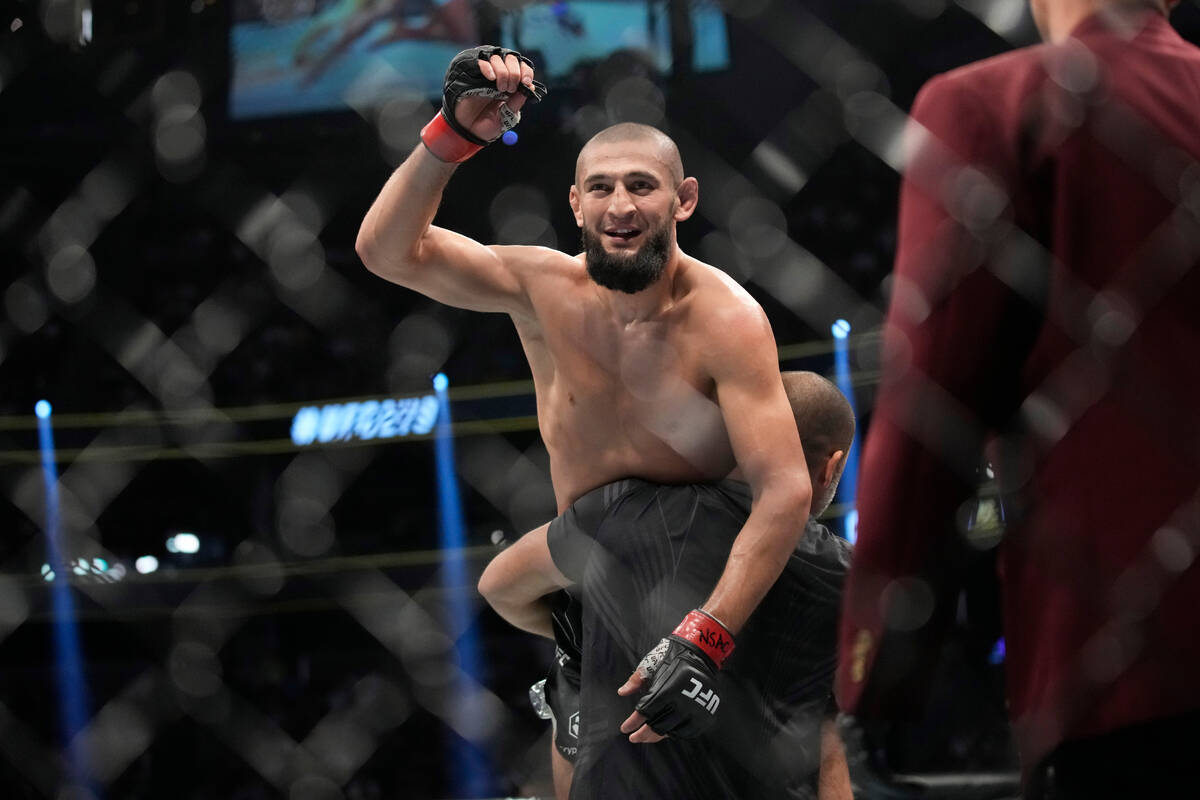 Khamzat Chimaev celebrates after defeating Kevin Holland in a 180-pound catchweight bout during ...