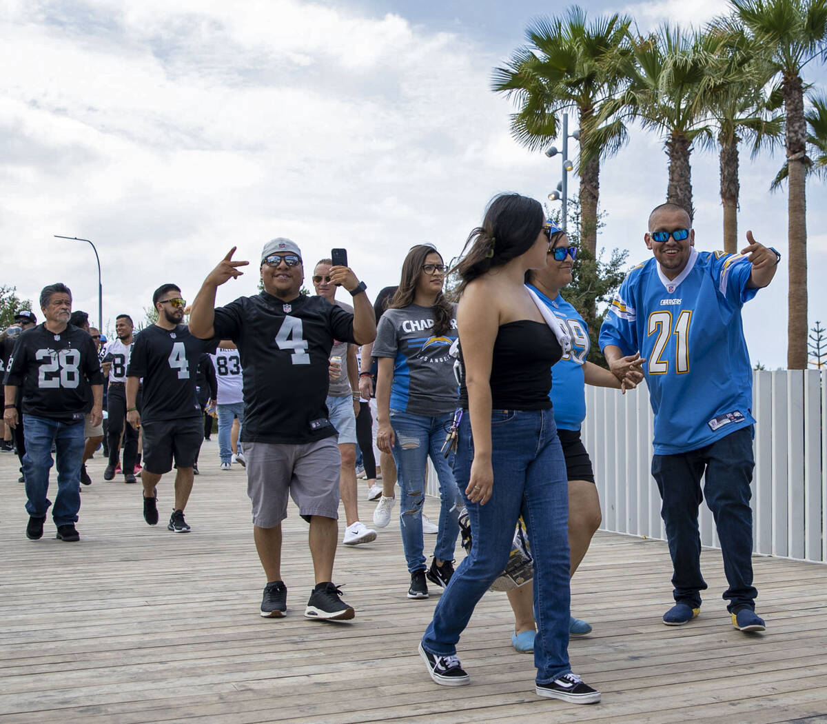Raiders and Los Angeles Chargers fans enter SoFi Stadium before an NFL game on Sunday, Sept. 11 ...