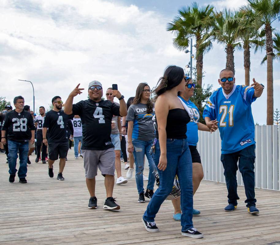 Raiders and Los Angeles Chargers fans enter SoFi Stadium before an NFL game on Sunday, Sept. 11 ...