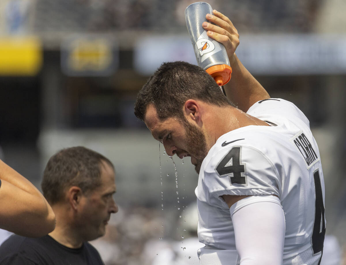 Raiders quarterback Derek Carr (4) cools off before an NFL game at SoFi Stadium against the Los ...