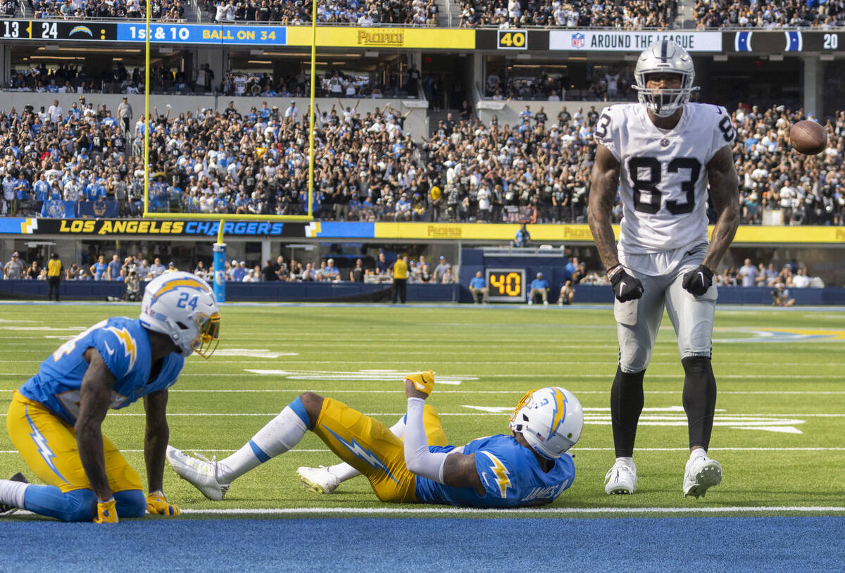 Raiders tight end Darren Waller (83) celebrates a big catch over Los Angeles Chargers safety De ...